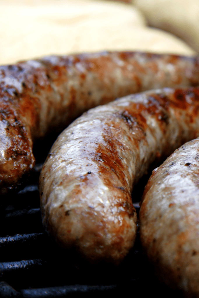 close up of brats grilling