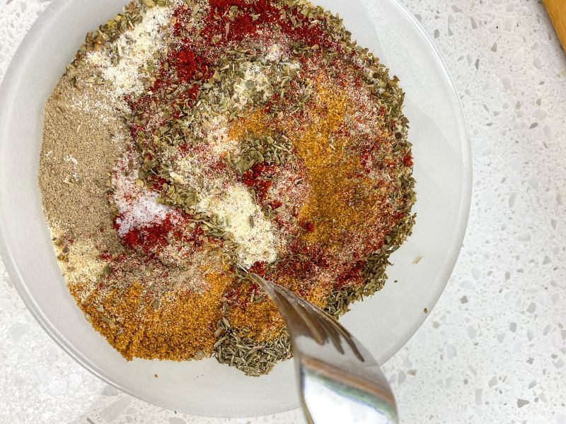 mixing the ingredients for the diy cajun seasoning