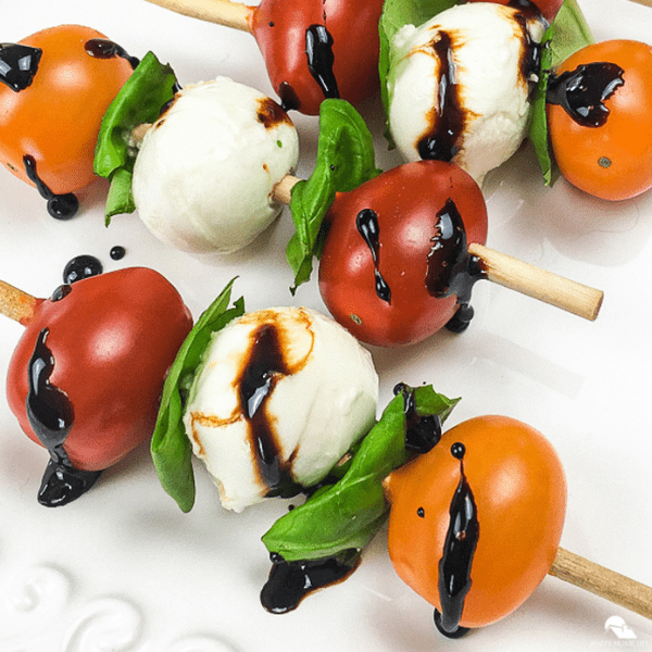 Finally a use for the giant martini glass you thought was such a great  idea! Caprese skewers!