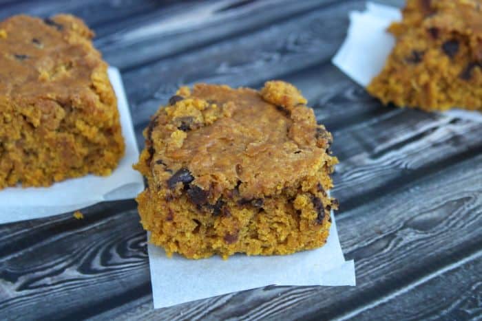 pumpkin blondies on faux wood background