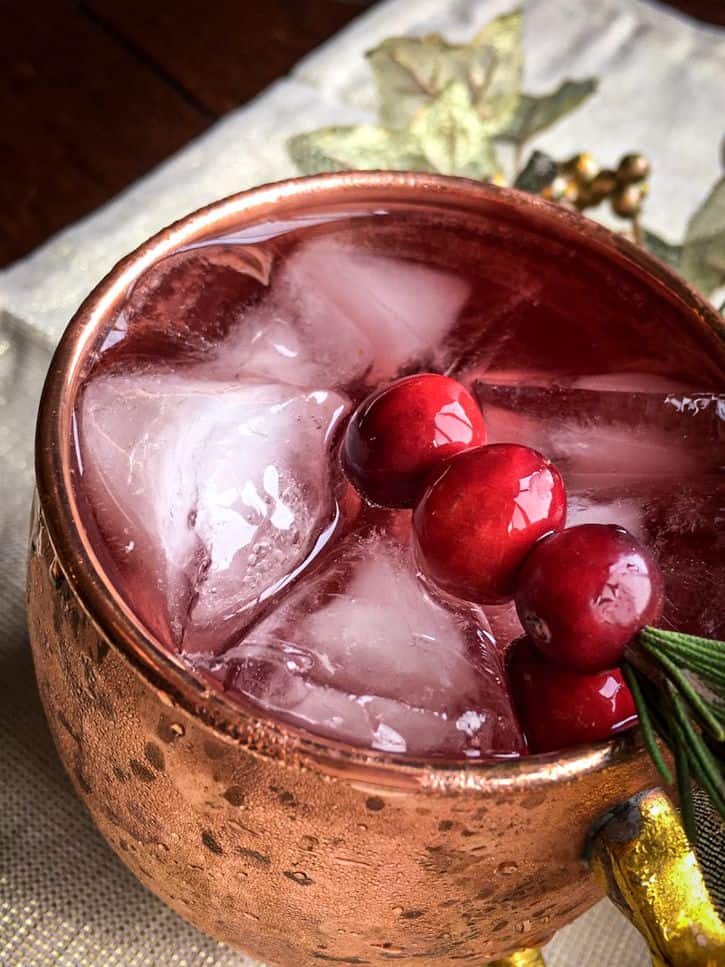 angled shot of cranberry moscow mule in mug