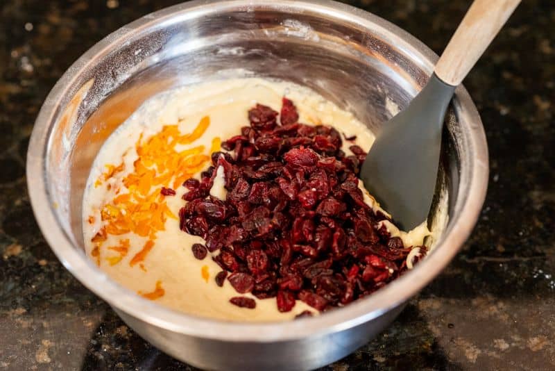 adding cranberries and orange zest