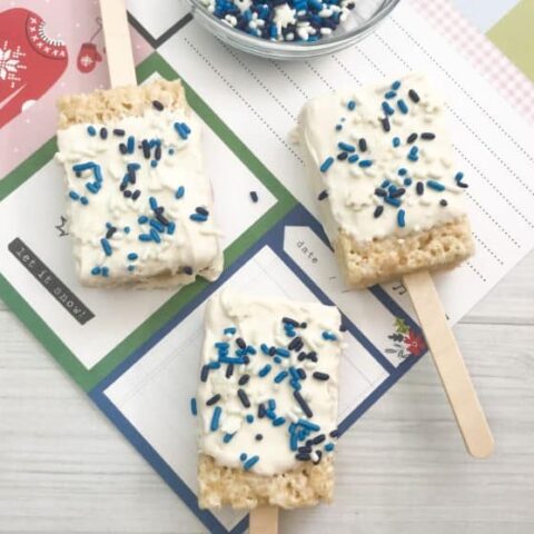 cute Rice Krispie Treats dipped in white chocolate with blue sprinkles