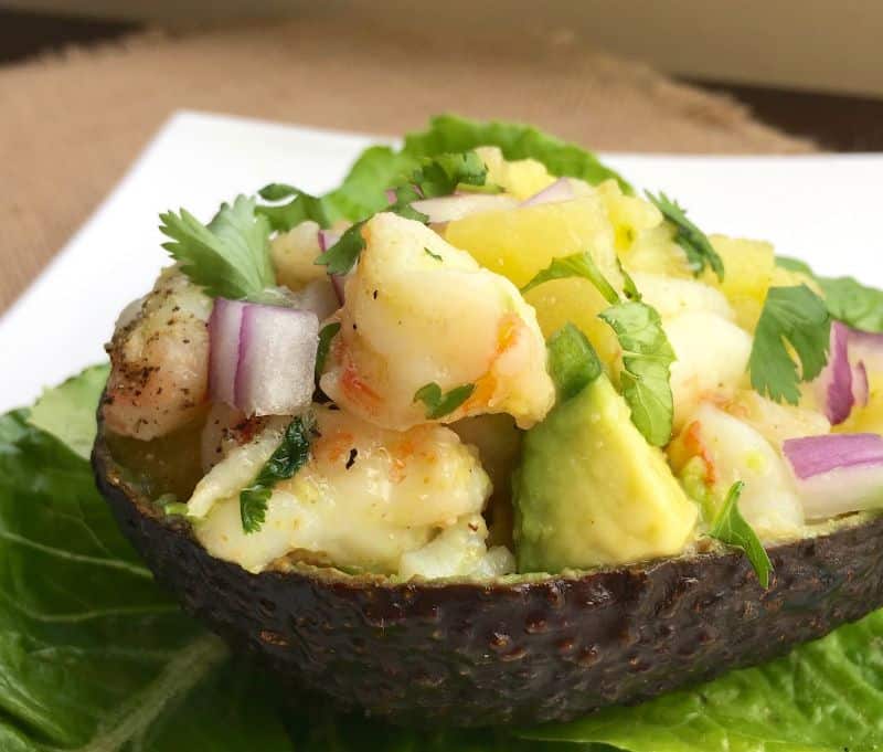close up picture of stuffed avocados with shrimp and pineapple filling