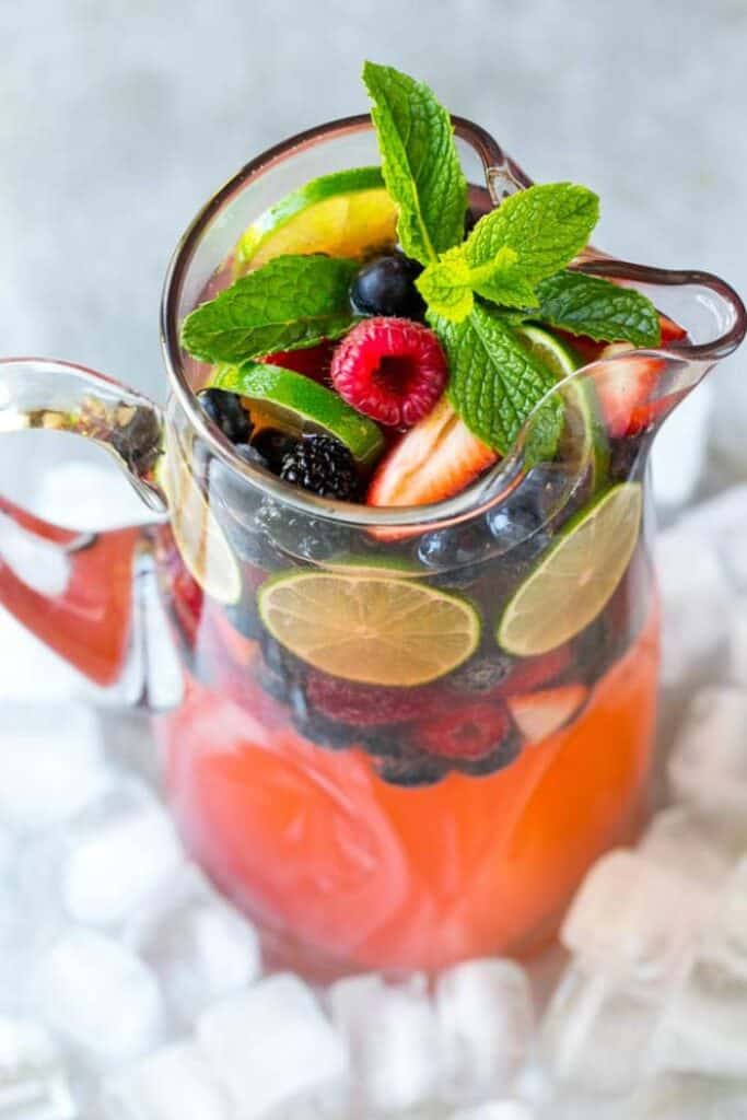 champagne punch in glass pitcher on ice