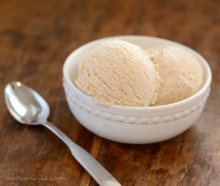 cinnamon ice cream in white bowl on wooden table