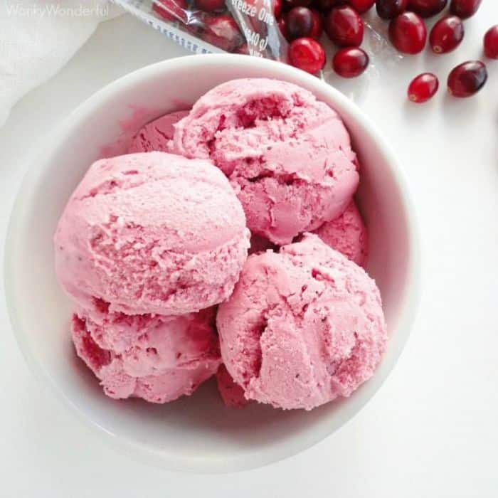 cranberry ice cream in a white bowl