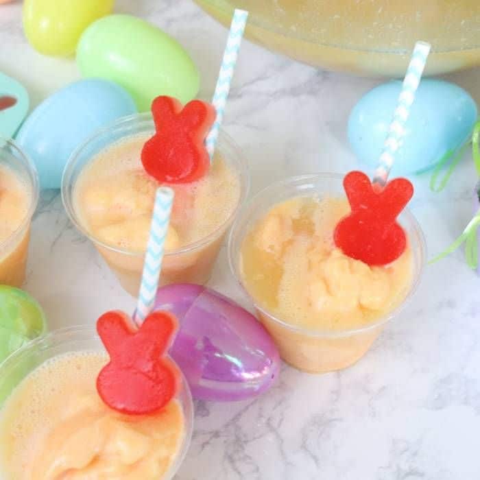 orange punch with straws decorated with red Jello bunnies