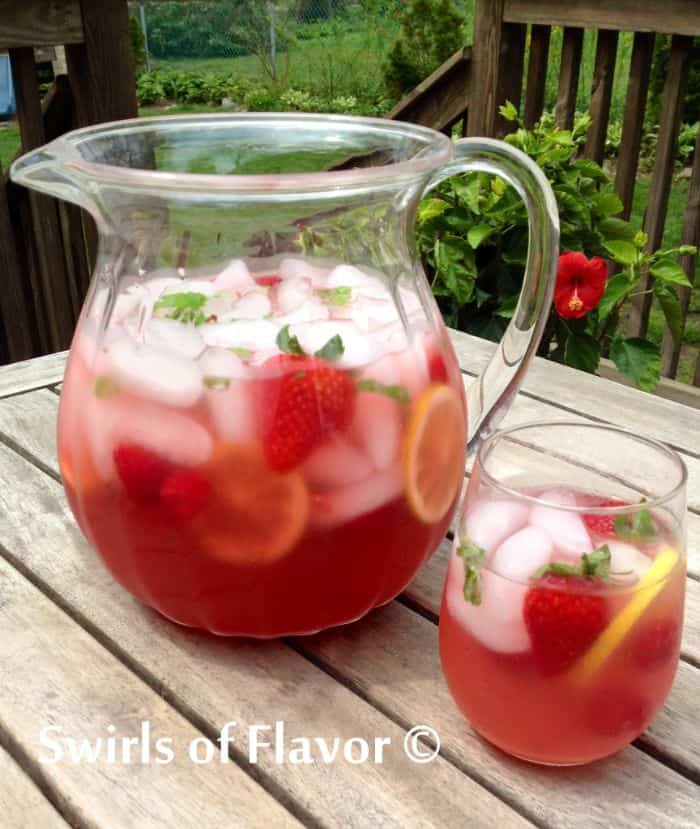 lemonade prosecco punch in glass pitcher with ice and fruit