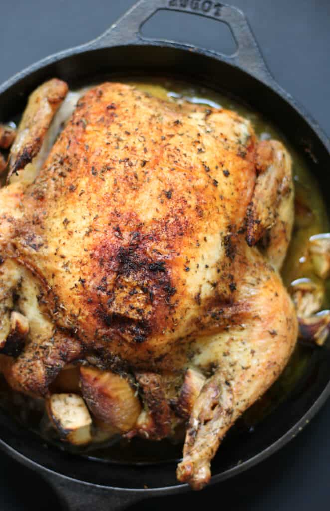 whole roasted chicken in a cast iron pan