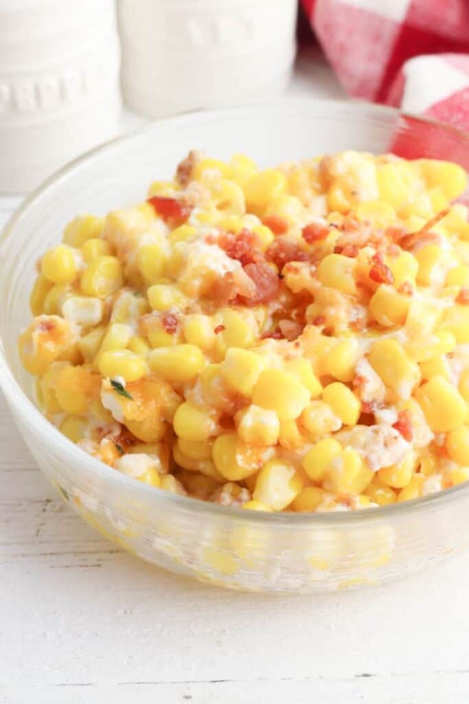 cheesy bacon and corn casserole in clear bowl