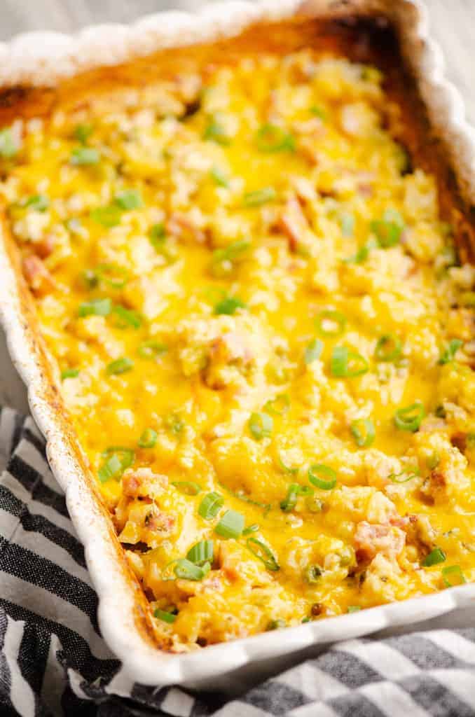 cheesy ham and rice casserole in white baking dish