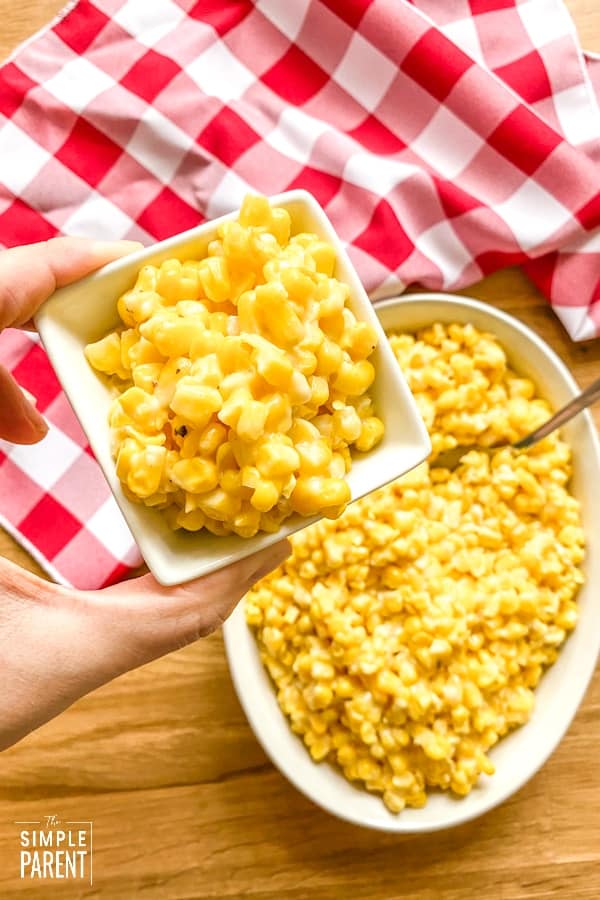 garlic parmesan fried corn in white dishes with red checkered napkin