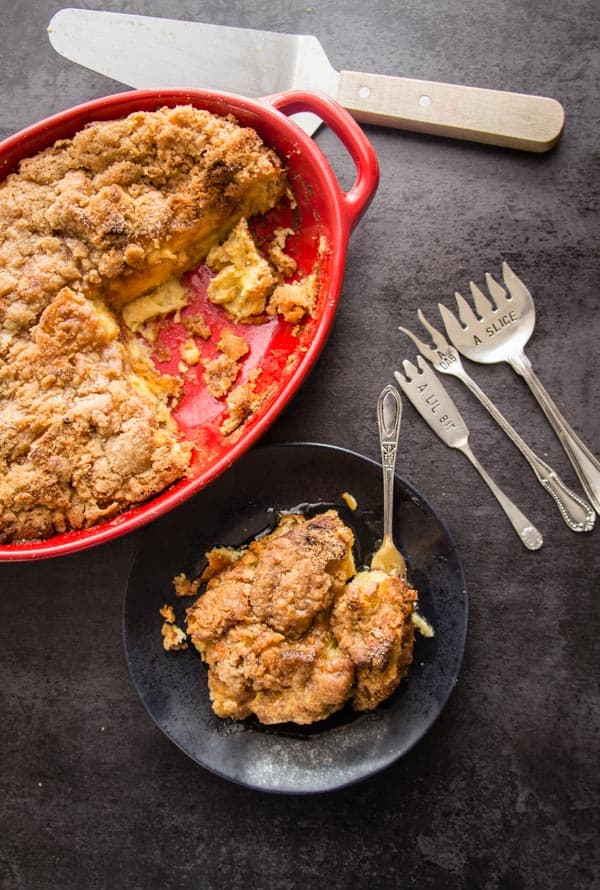 italian easter bread casserole in red baking dish with some on black plate