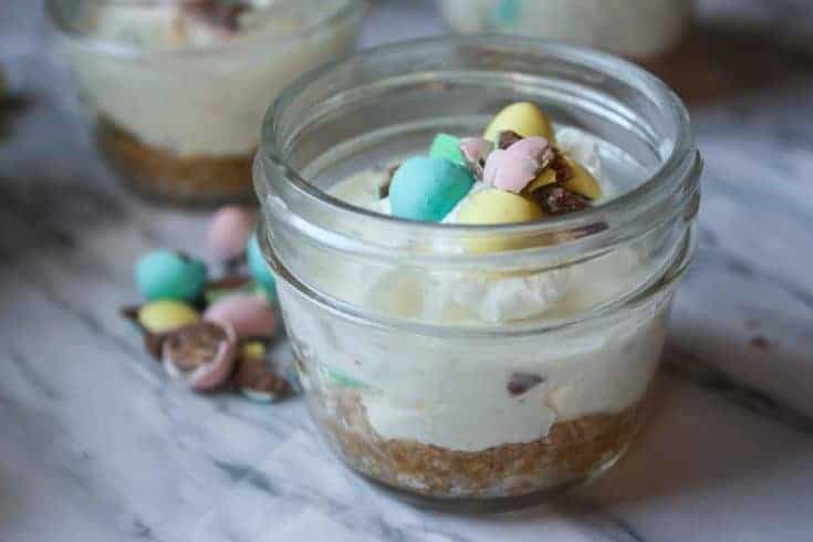 cheesecake in a jar topped with chocolate eggs