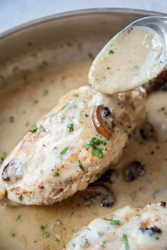 chicken breast stuffed with mushrooms in creamy pan sauce