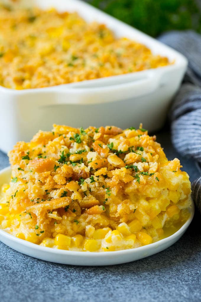 scalloped corn casserole in white dishes