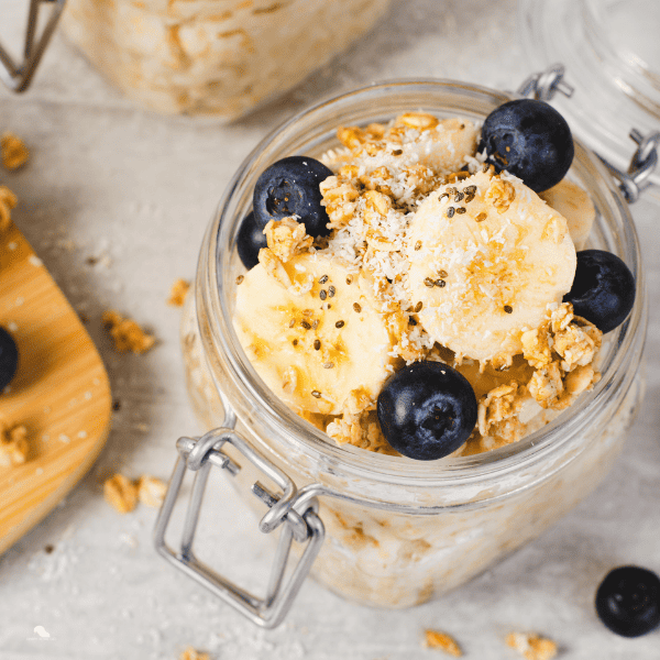 Oatmeal top in jars and bananas in a mason jar.