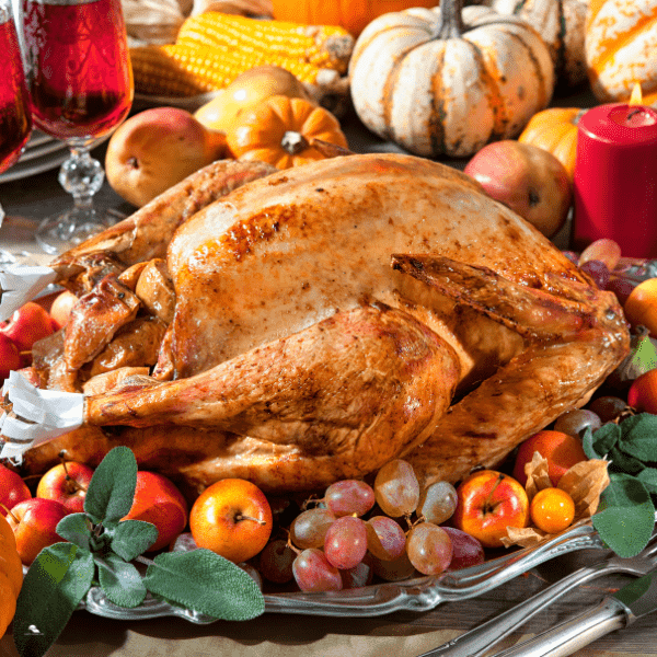Roasted turkey on holiday table.