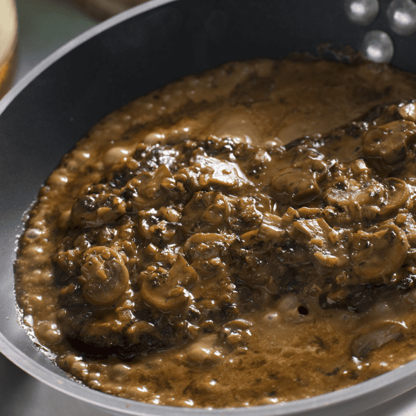 Steak Diane in a sauce pan.