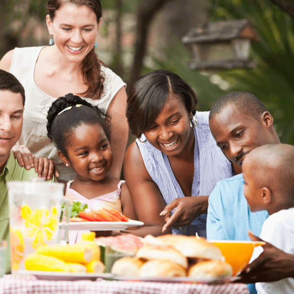 Two familites havinga picnic.