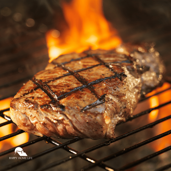 A well done steak grilled with flame