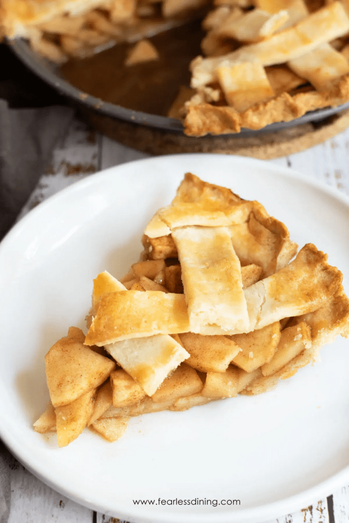 slice of gluten-free apple pie on white plate