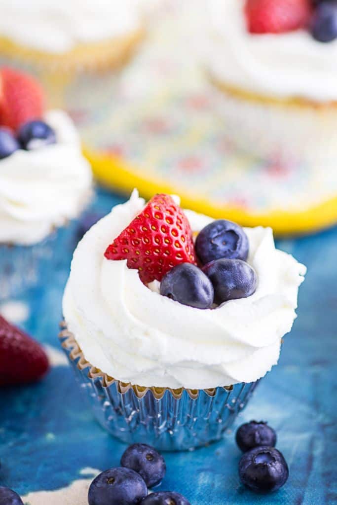 berries and cream cupcakes with strawberries and blueberries