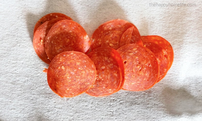 slices of pepperoni on paper towel