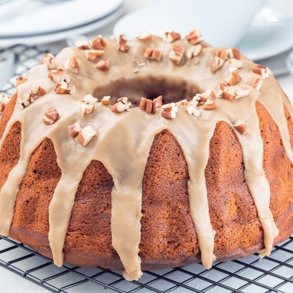 A close-up shot of a caramel pecan pound cake.
