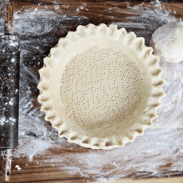 uncooked pie crust on a pie plate
