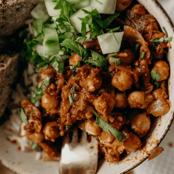 Vegan chili bowl served with spoon in it.