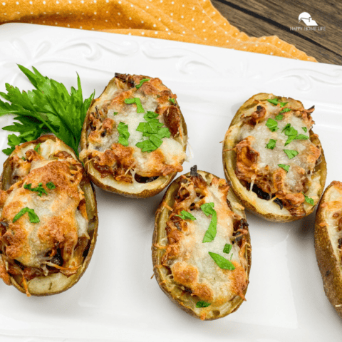Baked Potato Skins – Classic Version on a white plate, somehow close up