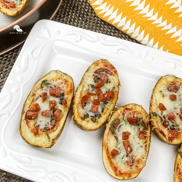 an overview image of Pizza-Stuffed Baked Potato Skins on a white plate