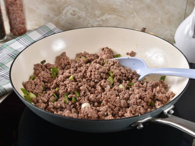 cooked ground beef in frying pan