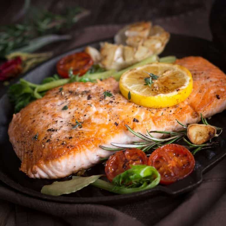 salmon and veggies in pan