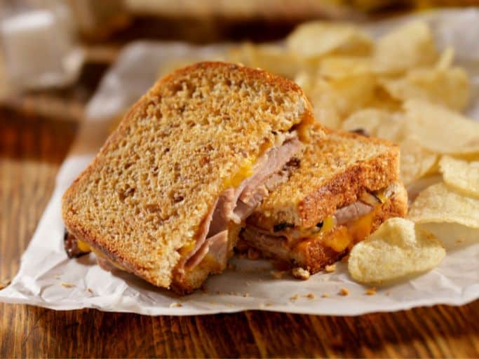 grilled roast beef and cheddar sandwich with chips