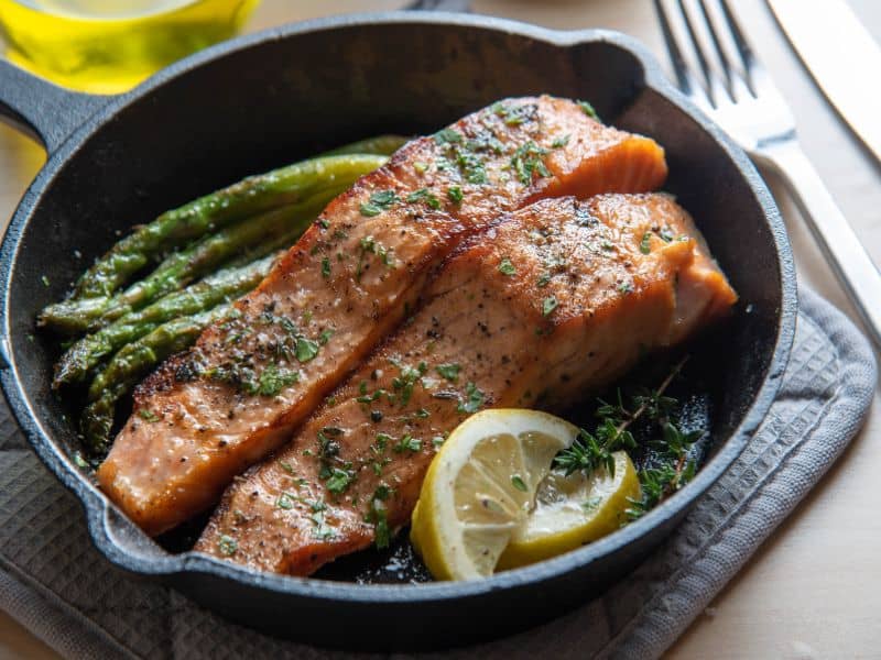 cooked salmon in a cast iron pan