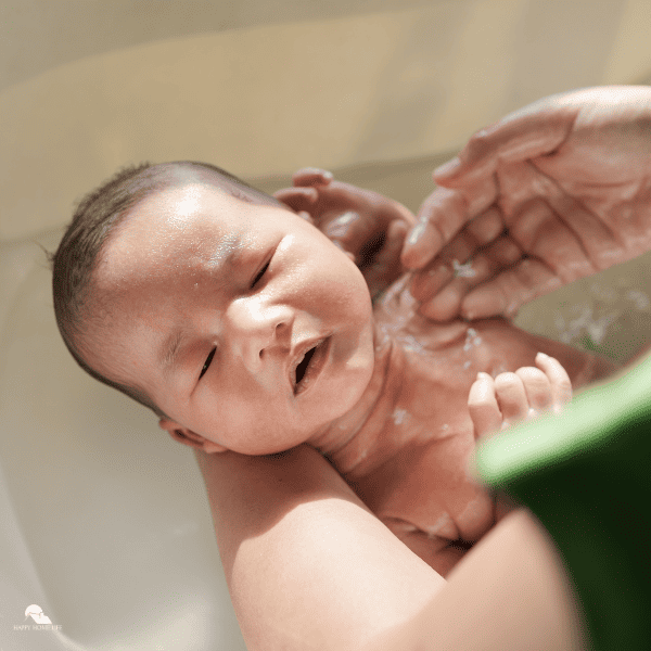 an image of a new born baby in a bath