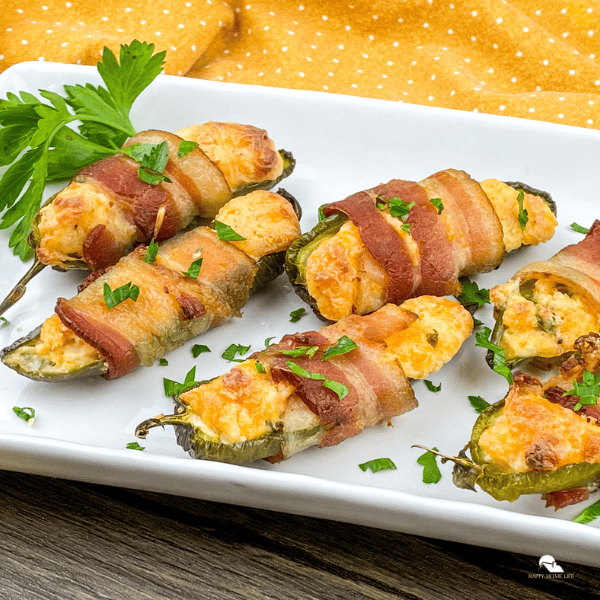Bacon Wrapped Jalapeno Poppers in a white plate – square size