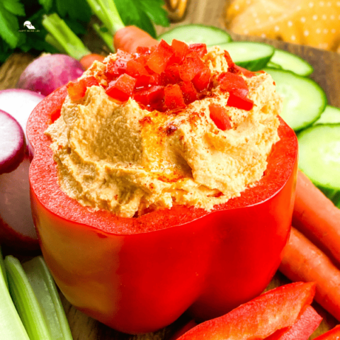 a square sized image of Roasted Red Pepper Hummus (close up)