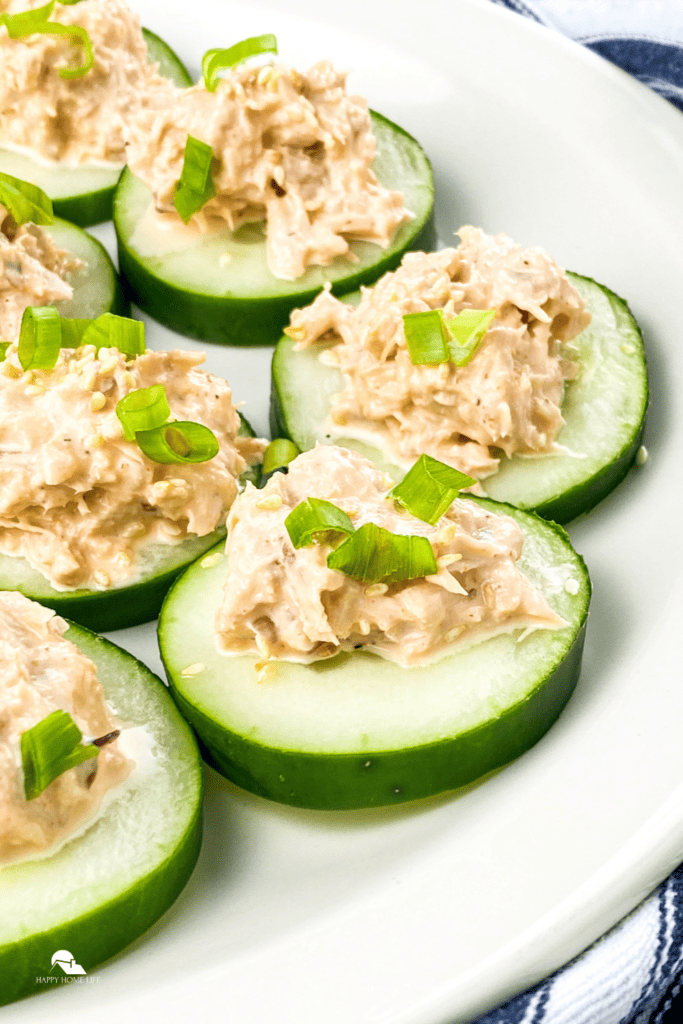 pin sized image of Spicy Tuna Cucumber Bites in a white plate