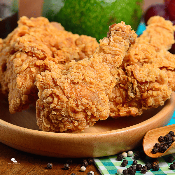 image of fried chicken in a wooden plate