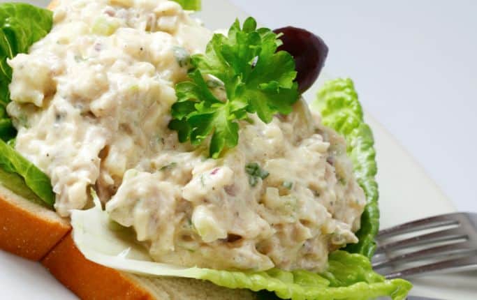 chicken salad on a piece of bread with lettuce