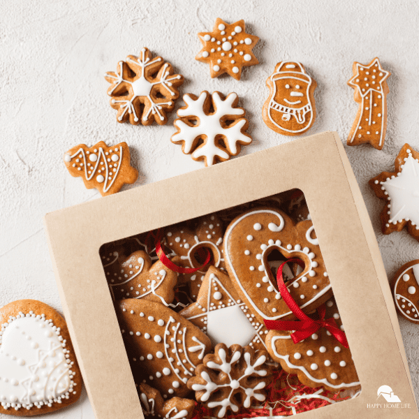 An image of boxed christmas cookies with other cookies around it.