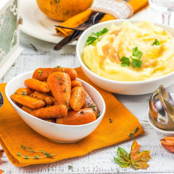 roasted carrots and mashed potatoes in bowls
