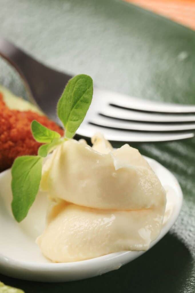 horseradish sauce in foreground, fork in background