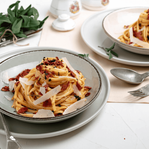 two plates of Browned Butter, Pumpkin, and Bacon Linguine