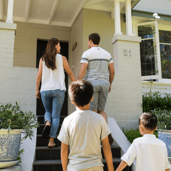 family going inside to their new home