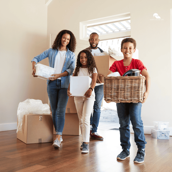 an image of a family unloading their stuffs to their new home